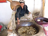 Uyghur woman at a silk factory, Khotan.