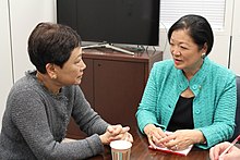 Photo of two women talking