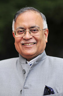 Head and shoulders portrait of Pradeep Kumar Kapur wearing Indian dress with pocket square.