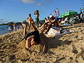 Boy lying on sand pile, June 2006