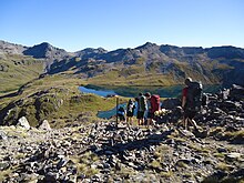 Trampers approaching Rotomaninitua / Lake Angelus in Nelson Lakes National Park