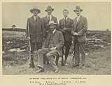 Team photograph of a rifle shooting team, in black and white.