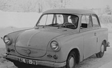 Two-door sedan, with a driver at the wheel