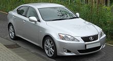 Front quarter view of a compact sedan parked on a street.