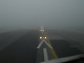 A319 pilot's view into dense fog (RVR 200 m) / Lisboa RWY 21