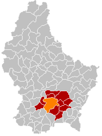 Map of Luxembourg with Луксембург highlighted in orange, the district in dark grey, and the canton in dark red