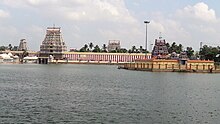 outer courtyard of a temple with two temple towers