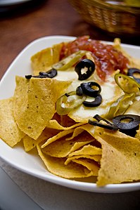 Plat de nachos, trossos triangulars de tortilla fregits