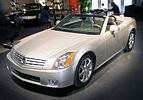 Cadillac XLR circa 2007, with fully retracted aluminum (i.e., lightweight) hardtop concealed by self-storing tonneau cover