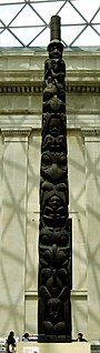 A wood coloured tall totem pole