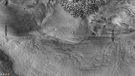 Dunes and old glaciers in Renaudot Crater, as seen by CTX camera (on Mars Reconnaissance Orbiter). Arrows point to old glaciers along the crater wall. Note: this is an enlargement of the previous image.