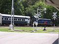 The Heart of Dixie Railroad Museum excursion train departs past the display of railroad signals.