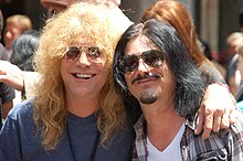 Adler (left) with Gilby Clarke in July 2012