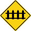 Railway crossing ahead that is protected by automatic gates