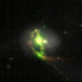 VLT MUSE image of Mrk 463, with H-alpha being orange and oxygen being green