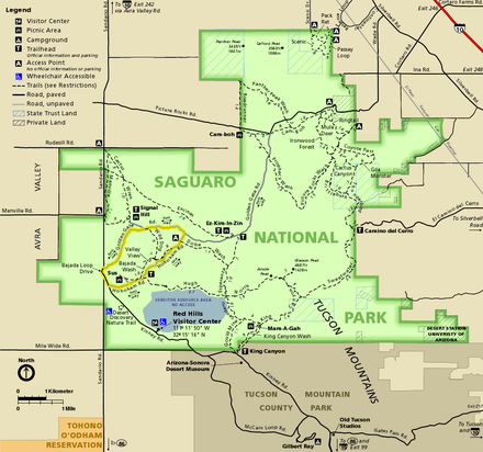 Map of the Tucson Mountain District, an irregular squarish shape colored green and surrounded by brown or gold-shaded areas not in the park