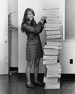 Margaret Hamilton next to (presumably a printout of) the navigation software she and her team produced for the 1969 Apollo Project (created by Draper Laboratory, nominated by Adam Cuerden)