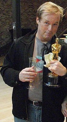 A photograph of Brad Bird in 2008, holding the Academy Award for Best Animated Feature