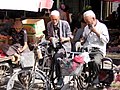 Tool sharpeners at the market, Khotan