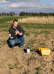 In an alternative cropping system plot, technician measures carbon dioxide loss due to tillage: Click here for full photo caption.