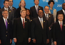 Huntsman, Vilsack, Kirk and Locke stand on stage for group photo. Click for larger image.