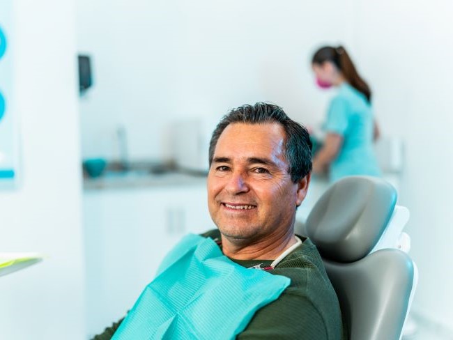 man seated in dentist's chair