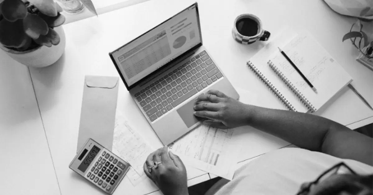 Black & white image of a person setting up their marketing automation.