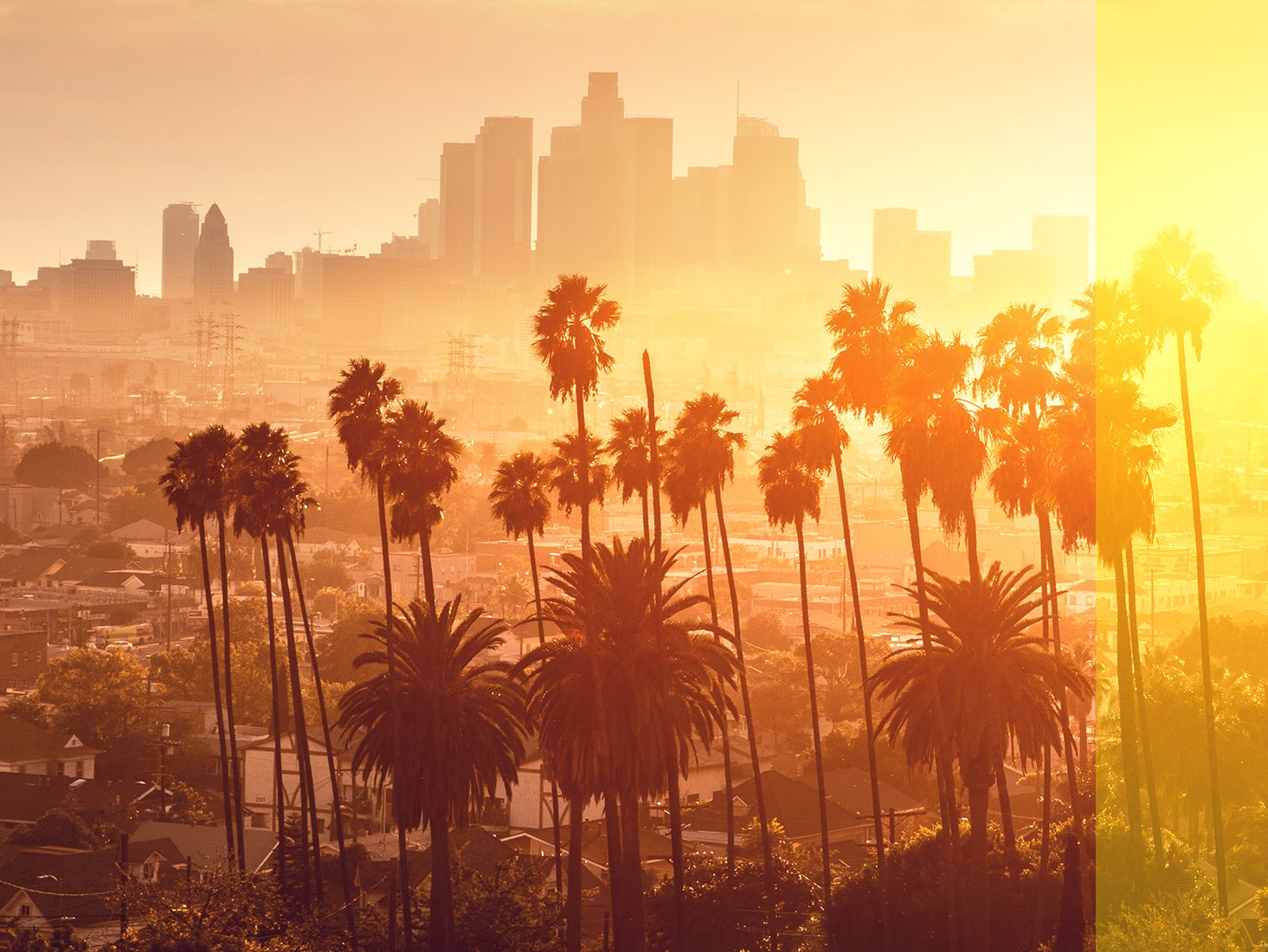 The setting sun creates a warm glow over Los Angeles.