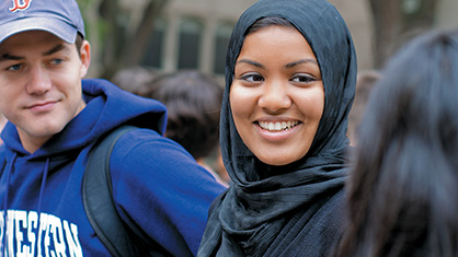 Student talking to a group of people