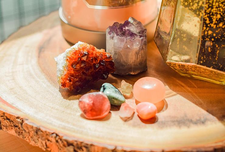 Natural Healing: How Crystals Can Heal Emotional Pain by Jennifer Daws. Photograph of a few crystals on a wooden table by Sarah Brown.