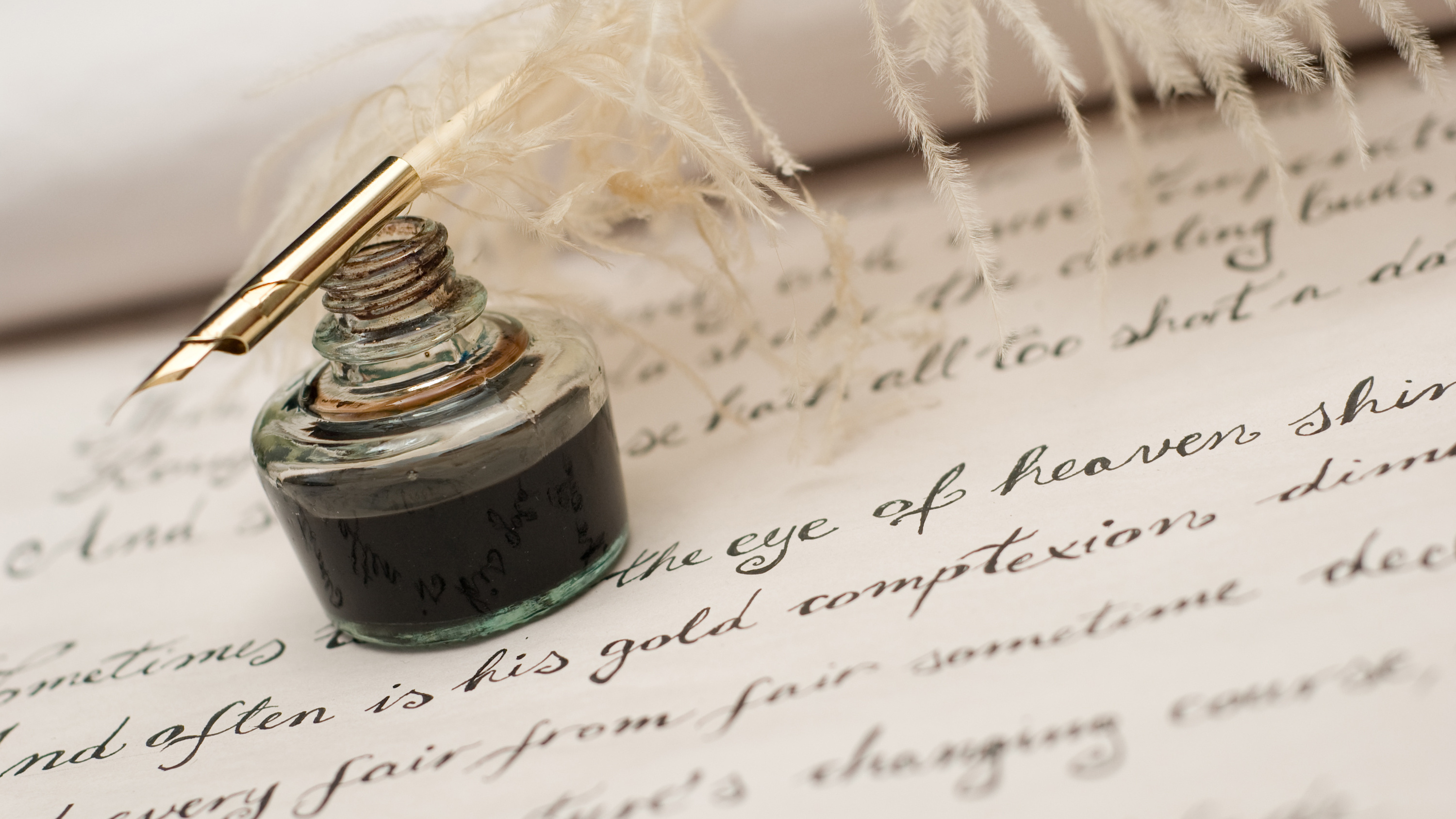 a fountain pen sitting on top of a piece of paper.