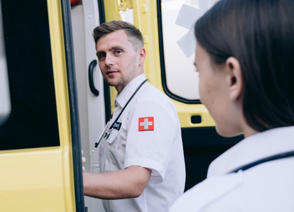 female paramedic in front of ambulance