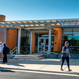 Woman walking out of Naperville Center