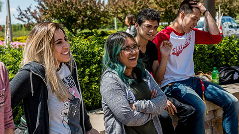 Group of students laughing ourdoors