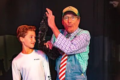 audience member on stage at The Comedy Barn