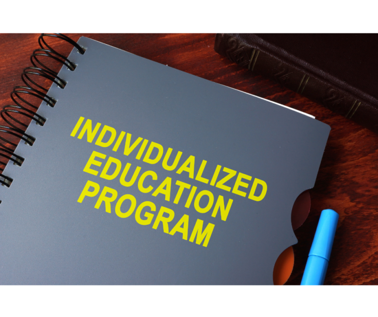 Gray spiral bound notebook with yellow text reading 'Individualized Education Program'.