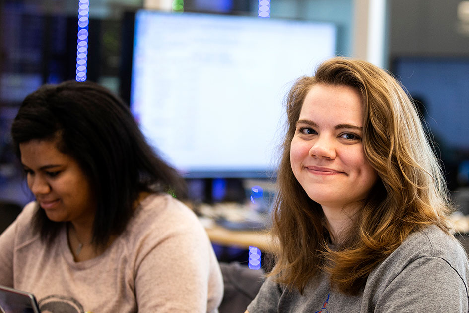 students smiling in a classroom