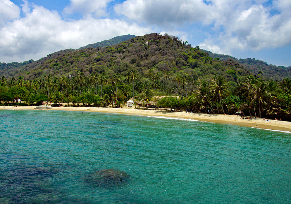  Rocks, beach, blue sea, vellow boat and beautiful coconut lined beach