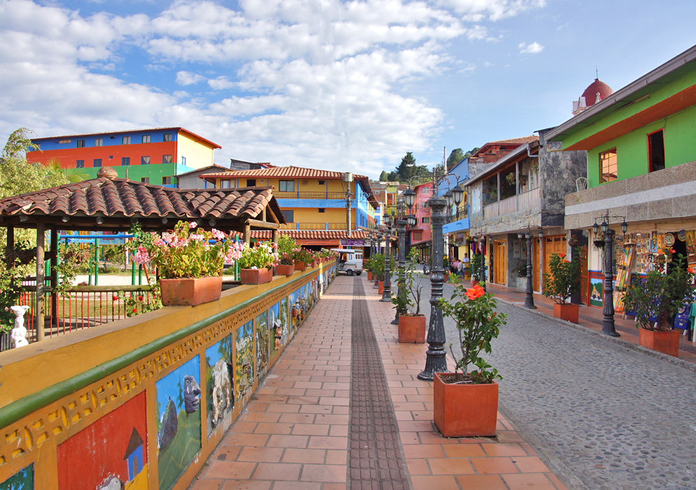 Narrow street lined by colorful buidings