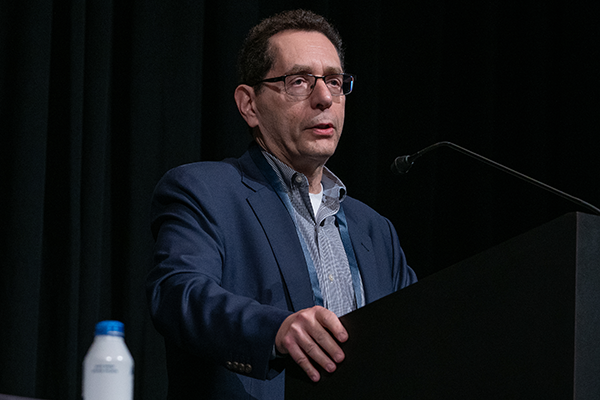 A man speaking at a podium