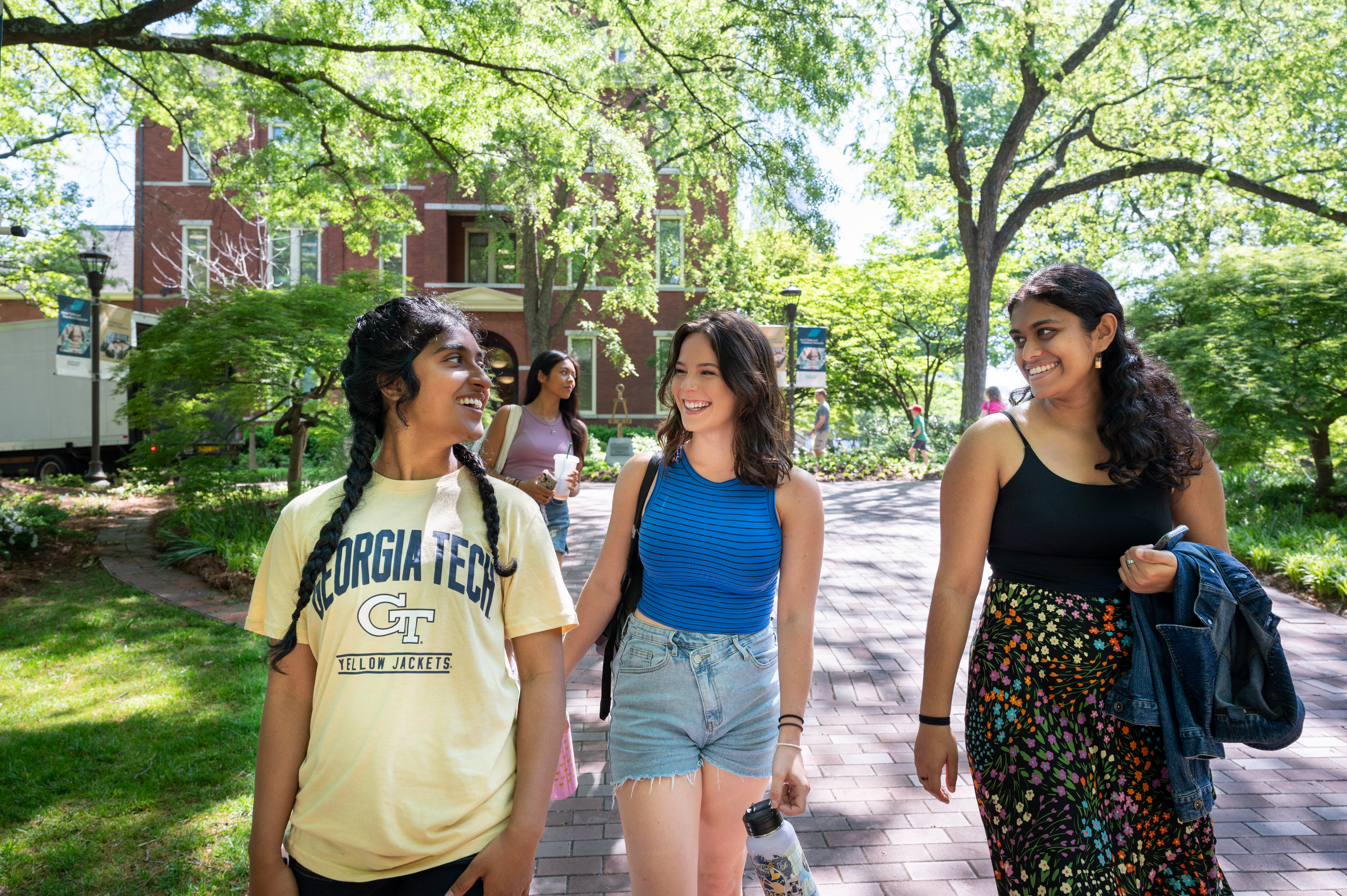 Three students walking outside together on Tech campus