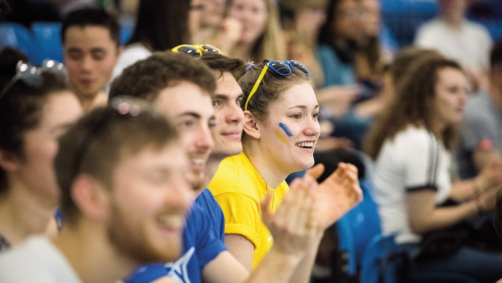 Students watching a sports game.