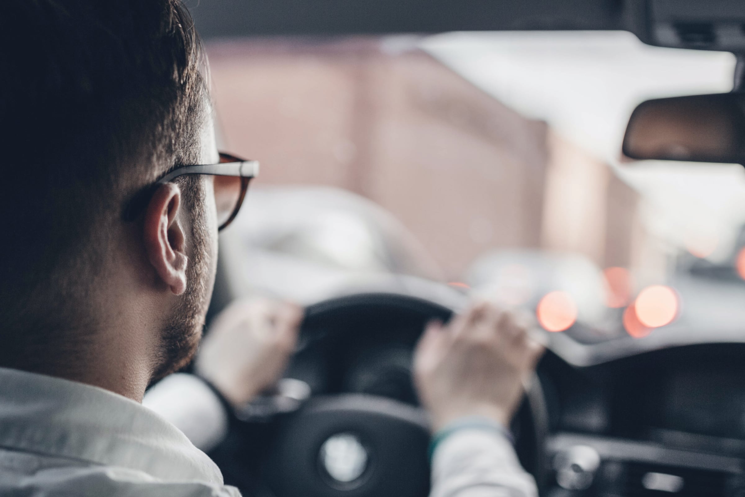 A man driving a car.