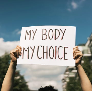 Sign featuring the message MY BODY MY CHOICE held by a person outdoors