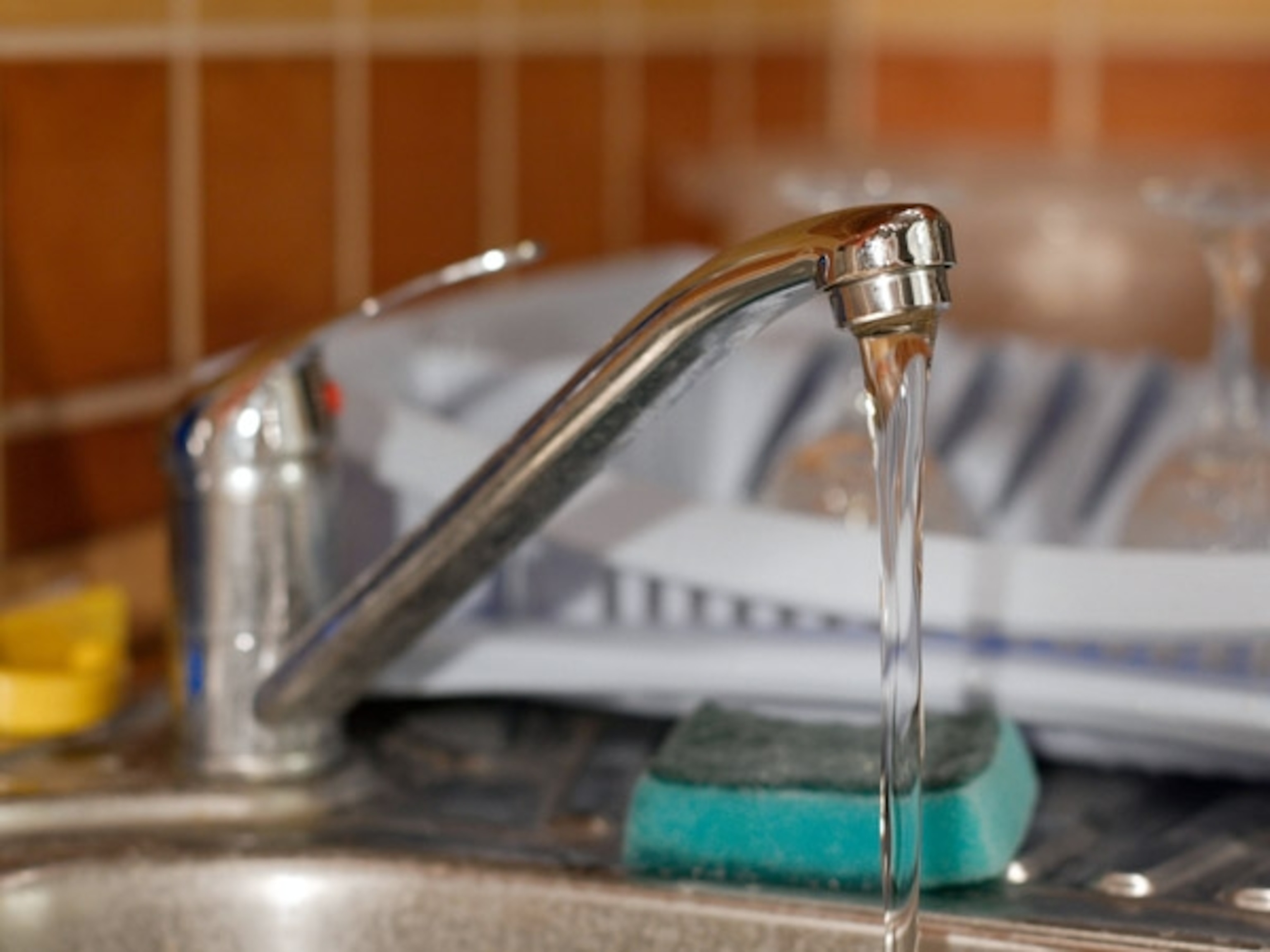 Water flowing from a tap