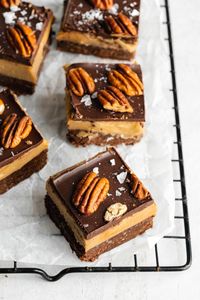 You need to try these easy vegan caramel brownies to believe just how good they are! They have the fudgiest brownie base made from wholefood ingredients like walnuts and dates, topped in a gooey salted date caramel. Topped with chocolate, nuts, and sea salt, they're the perfect decadent treat that's also gluten-free!