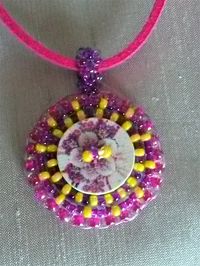 £14.00  Bead and button embroidery pendant