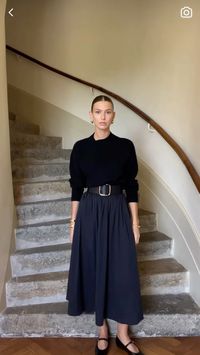 Black maxi skirt, black thick belt and black top. Wearing blak flat mary janes