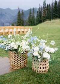 French Countryside inspired floral baskets   Florist: Hosanna.Floral || Photographer: SarahPorterPhotos