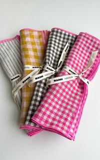 We are so excited to introduce our latest batch of custom color combinations for the shop from our friends at madre.    we are so in love with the mix of checks stripes ginghams all with a pop of bubble gum pink edging.    each set includes 4 100% linen matching napkins.    madre’s linen is grown in belgium and produced in lithuania. woven in a mill that runs on green energy it is also oeko-tex certified. our napkins are designed and sewn in our hometown of portland or.